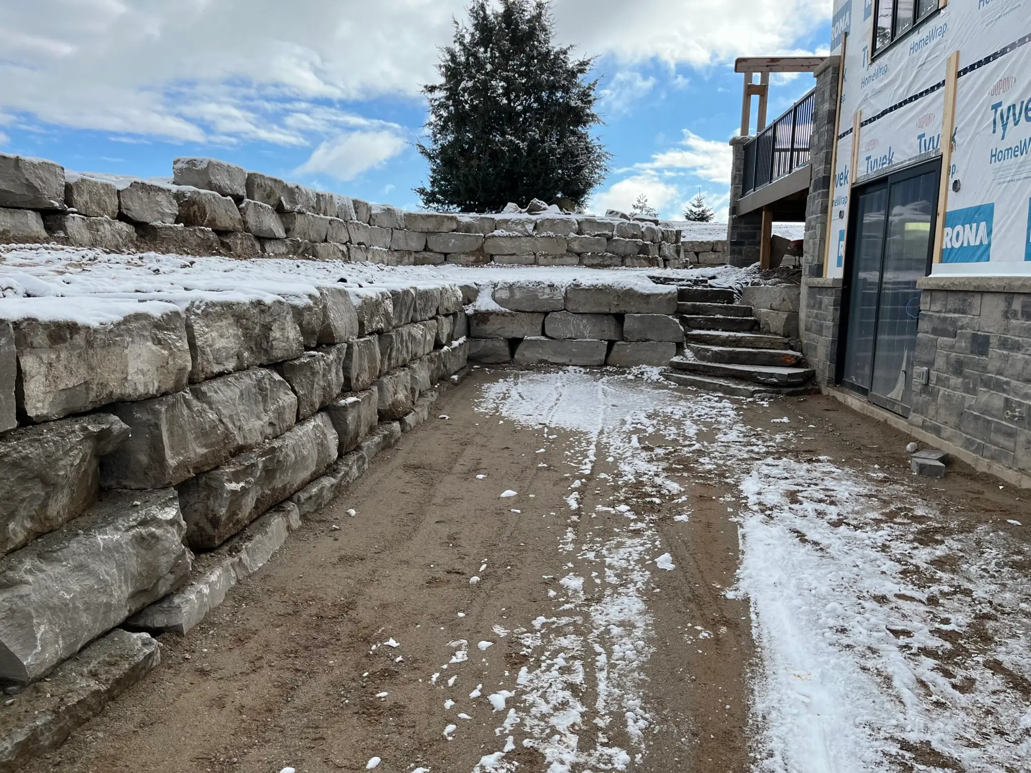 An engineered retaining wall installation by MBM Conscapes in Alliston, ON