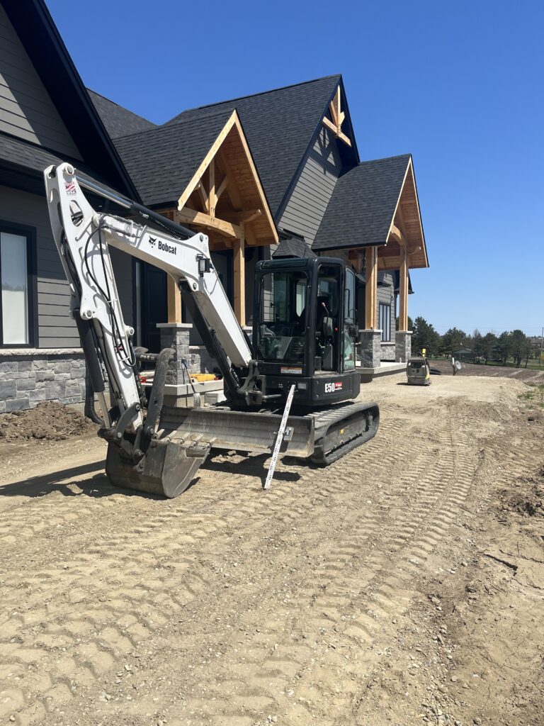 An excavation of front interlock walkway by MBM Conscapes in Alliston, ON