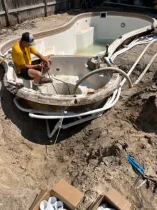 Pool company renovating pool plumbing